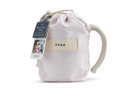16 oz Demdaco Nana Heart Mug in cream stoneware in pink fabric pouch, microwave and dishwasher safe, available at Be Charmed. 