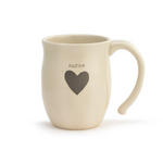 Demdaco Nurse heart-shaped 16 oz stoneware mug with raised heart motif and “Nurse” sentiment; microwave/dishwasher safe—available at Be Charmed.