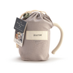 Pictured in pouch; Demdaco Nurse heart-shaped 16 oz stoneware mug with raised heart motif and “Nurse” sentiment; microwave/dishwasher safe—available at Be Charmed.