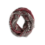 Textured  Red Infinity Scarf in soft, cozy knit with elegant woven texture—versatile, warm, and stylish. Perfect for layering. Available at Be Charmed