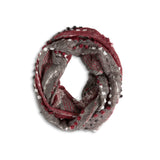 Textured  Red Infinity Scarf in soft, cozy knit with elegant woven texture—versatile, warm, and stylish. Perfect for layering. Available at Be Charmed