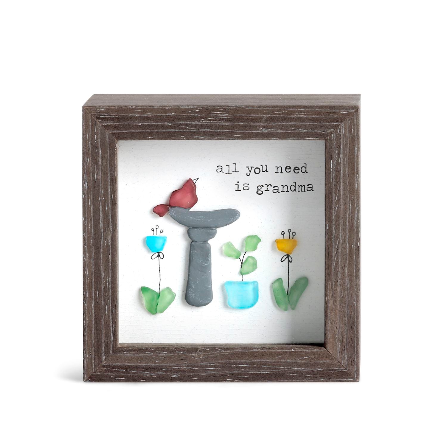 Decorative wall art with a frame, plants, and text on a white background. Available at Be Charmed