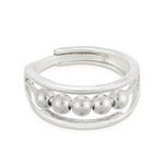 A silver-colored ring with multiple small spherical embellishments around the band, designed to be adjustable by pinching at the back.  Available at Be Charmed