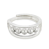 A silver-colored ring with multiple small spherical embellishments around the band, designed to be adjustable by pinching at the back.  Available at Be Charmed