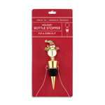 Displayed on card:  Demdaco Snowman Bottle Stopper with hand-painted details and festive scarf—adds holiday cheer to your wine bottles. Available at Be Charmed.