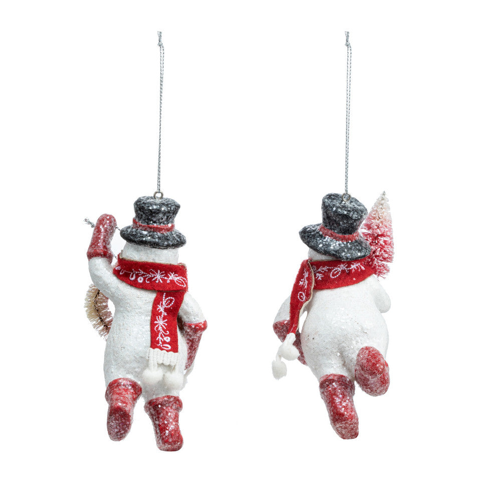 Back view of Demdaco hand‑painted “Sparkly Snowmen” glass ornament with silver glitter accents and red ribbon hanger—festive holiday décor. Available at Be Charmed.
