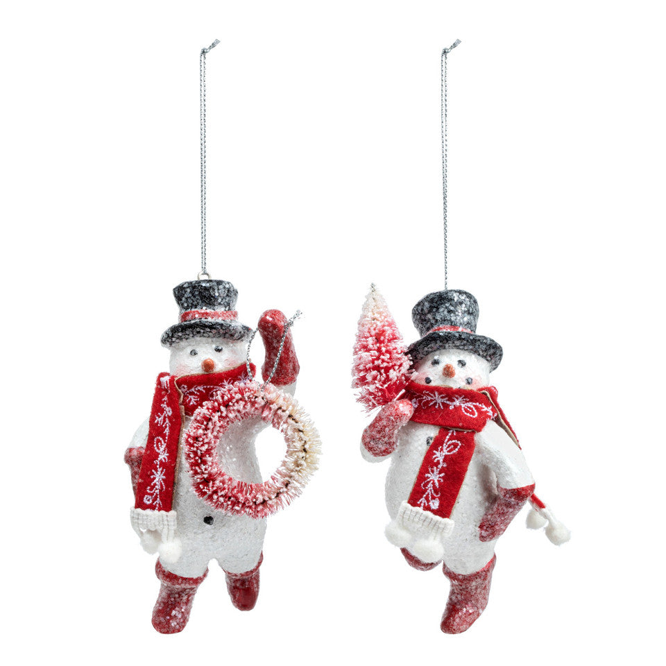 Demdaco hand‑painted “Sparkly Snowmen” glass ornament with silver glitter accents and red ribbon hanger—festive holiday décor. Available at Be Charmed.