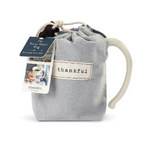 Demdaco Thankful Heart Mug in cream stoneware with a heart design in fabric pouch, available at Be Charmed.