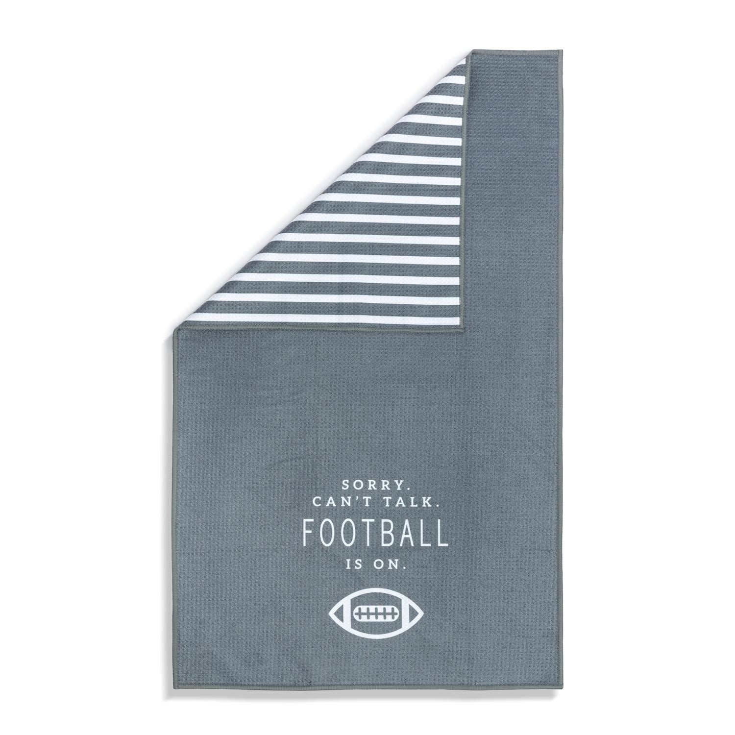 Gray towel with striped corner and text 'Sorry can't talk. Football is on.' Available at Be Charmed