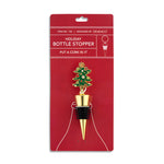 Demdaco Tree bottle stopper displayed on package, 4″ tall metal & silicone stopper topped with decorated green Christmas tree—available at Be Charmed.