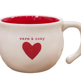 close up of Demdaco 16 oz stoneware Warm & Cozy Heart Soup Bowl, 4.5″×3.5″ cream ceramic with heart motif and hand‑thrown feel—available at Be Charmed.