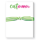 A white notepad with a green and pink 'Cat Mom' text and a decorative green ribbon bow. Available at Be Charmed