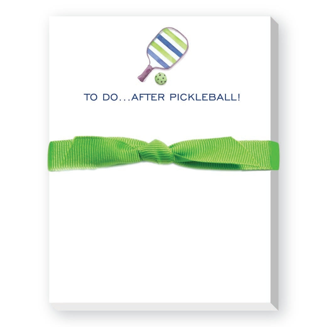 Mini notepad with a pickleball-themed design and the text 'TO DO...AFTER PICKLEBALL!' on the cover, tied with a green ribbon. Available at Be Charmed