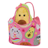 A plush toy handbag with a fun food theme, featuring a cartoon avocado, sloth, and caticorn characters, and a pink color scheme with a small plush toy inside. Available at Be Chare