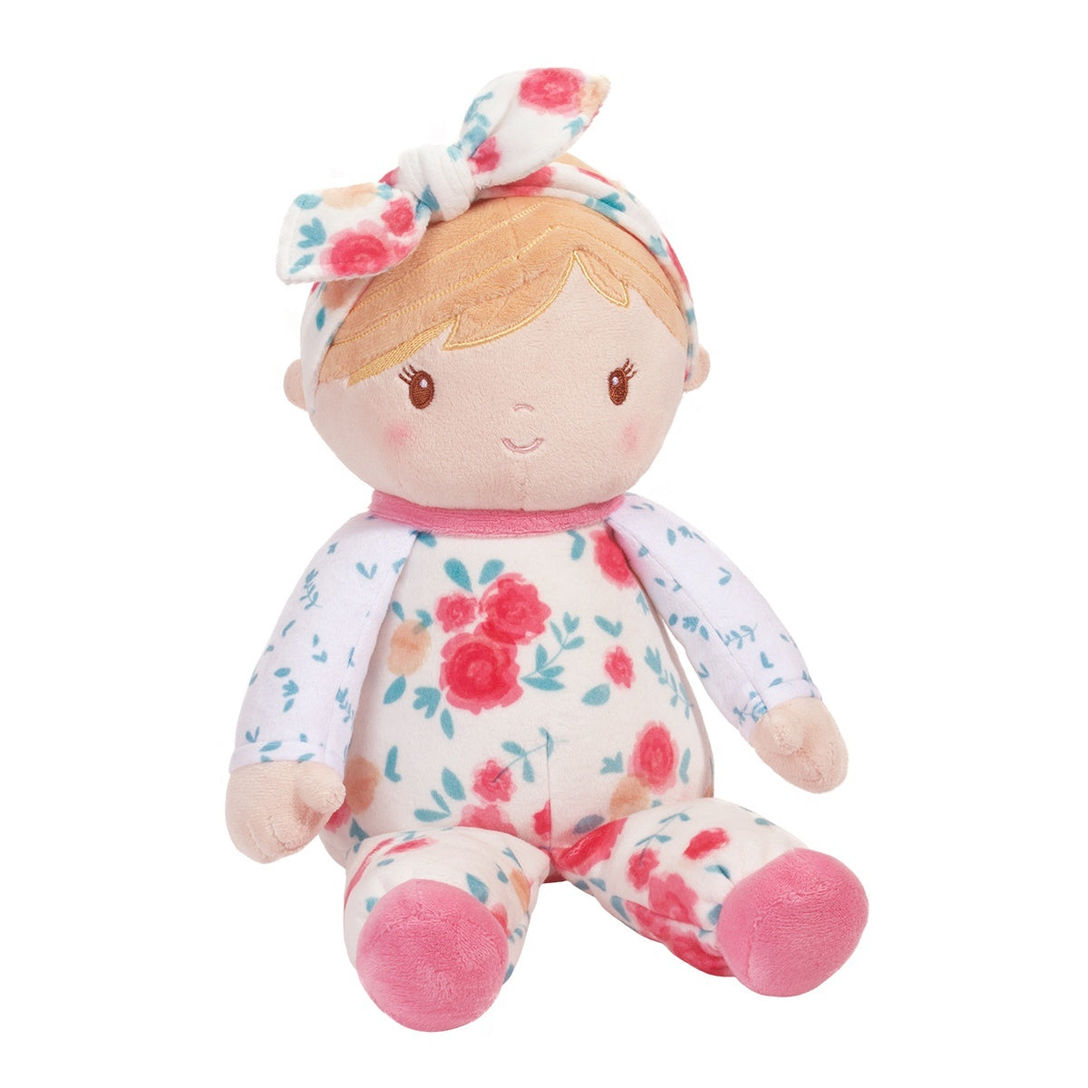 A floral-print plush doll with a bow headband, resembling a baby girl, in pajamas with floral design and the brand Douglas visible. Available at Be Charmed