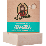 Dr. Squatch Coconut Castaway bar soap with coconut shreds, milk & toasted coconut scent. Light‑grit exfoliation. Available at Be Charmed.