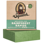Dr. Squatch Rainforest Rapids bar soap with eucalyptus, pumice exfoliation & crisp jungle scent. Light‑grit natural formula. Available at Be Charmed.