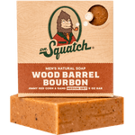 Dr. Squatch Wood Barrel Bourbon bar soap — natural, medium‑grit, spicy bourbon and oak scent, available at Be Charmed