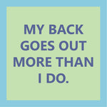 Text 'MY BACK GOES OUT MORE THAN I DO.' on a green coasternwith a blue background. Available at Be Charmed