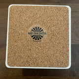 Back of Funny "Drinks on Me" coaster with playful design, perfect for parties and bars. A humorous bar accessory by Drinks on Me brand. Available at Be Charmed.