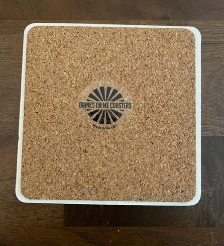 Back of Funny "Drinks on Me" coaster with playful design, perfect for parties and bars. A humorous bar accessory by Drinks on Me brand. Available at Be Charmed.