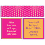 Two humorous wine-themed sayings on pink and orange napkin with a geometric pattern.