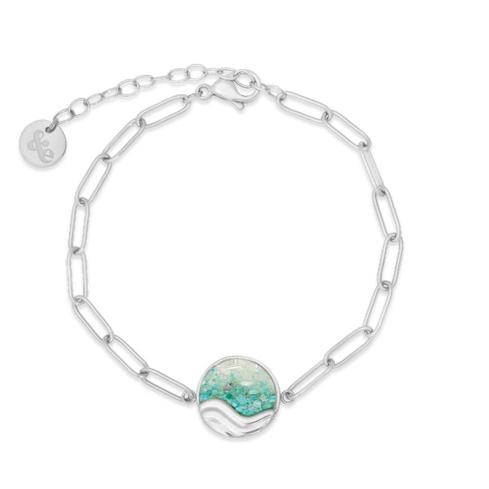 Silver chain bracelet with a turquoise stone on a white background. Available at Be Charmed
