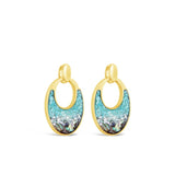Gold hoop earrings with turquoise stone centers on a white background. Available at Be Charmed