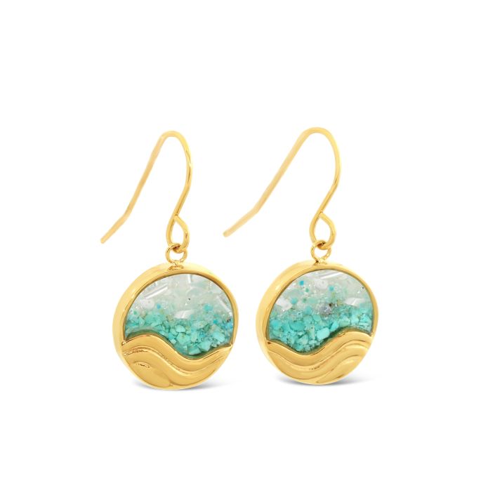 Gold earrings with turquoise stones on a white background. Available at Be Charmed