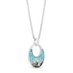 Silver necklace with a turquoise pendant on a white background. Available at Be Charmed