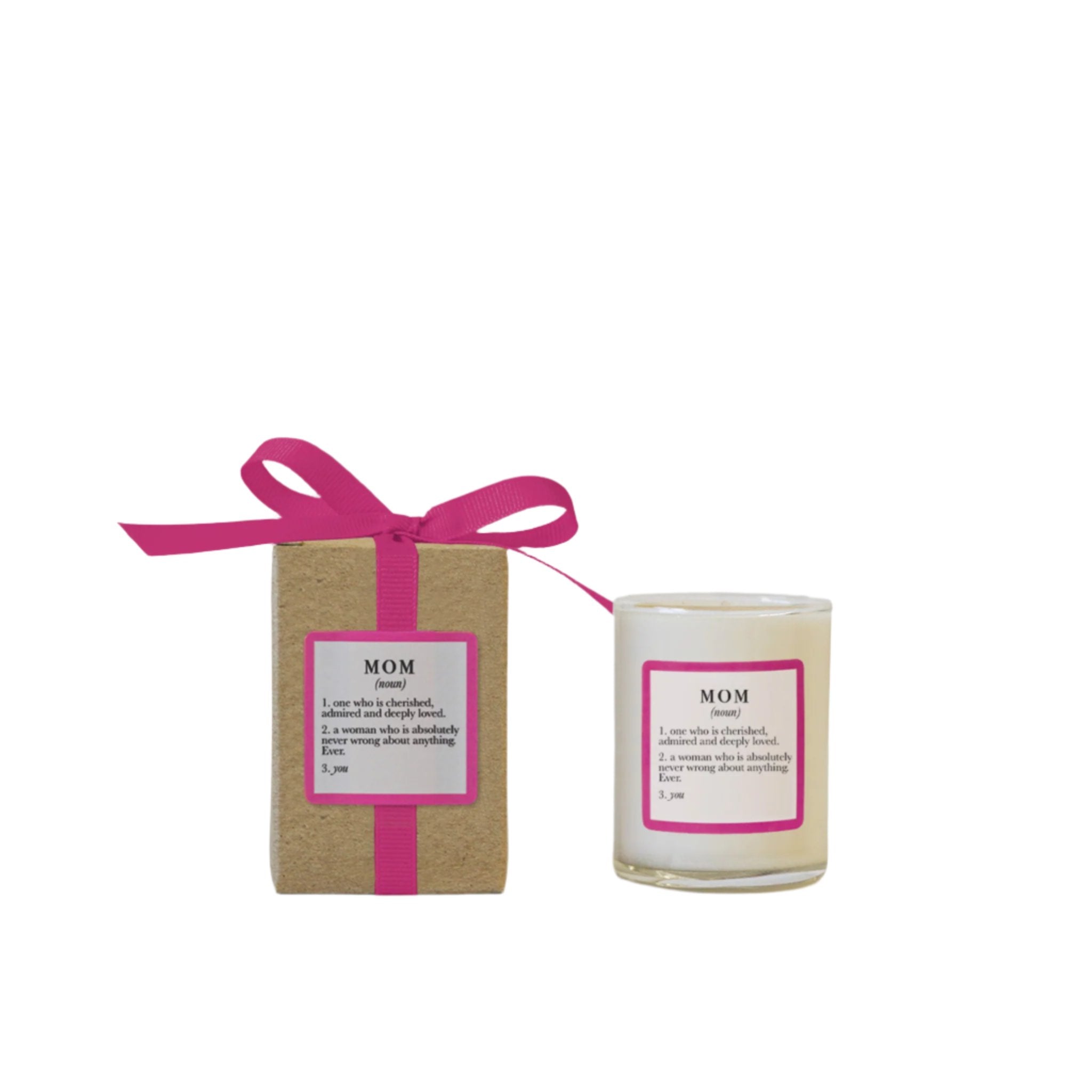 A 3oz candle packaged in a brown box with a pink ribbon, labeled 'MOM', accompanied by a card with 'MOM' in bold letters. Available at Be Charmed