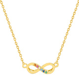 Gold necklace with an infinity symbol pendant featuring colorful stones on a white background. Available at Be Charmed