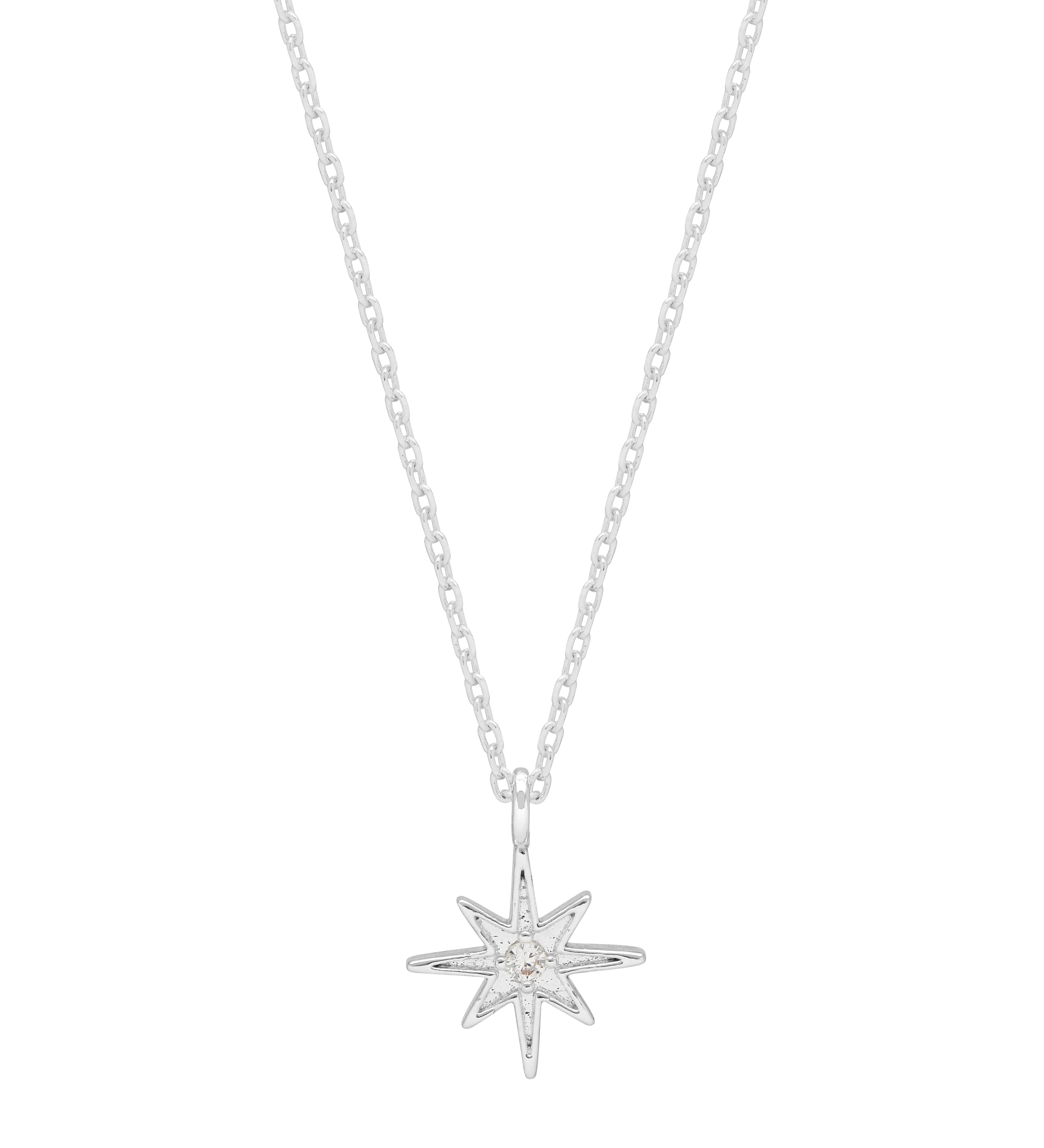 Silver star-shaped pendant on a chain against a white background. Available at Be Charmed
