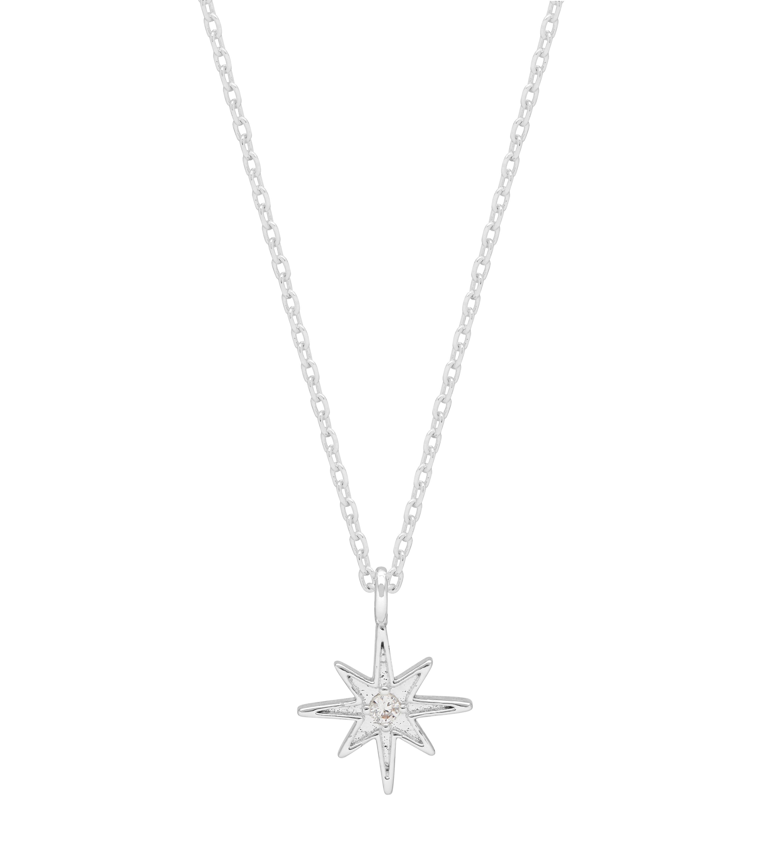 Silver star-shaped pendant on a chain against a white background. Available at Be Charmed