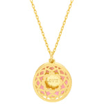 Gold necklace with a round pendant featuring the word 'LOVE' on a white background. Available at Be Charmed