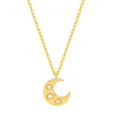 Gold necklace with a crescent moon pendant on a white background. Available at Be Charmed