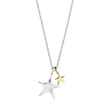 Star-shaped pendant necklace with two stars, one gold and one silver, on a white background. Available at Be Charmed