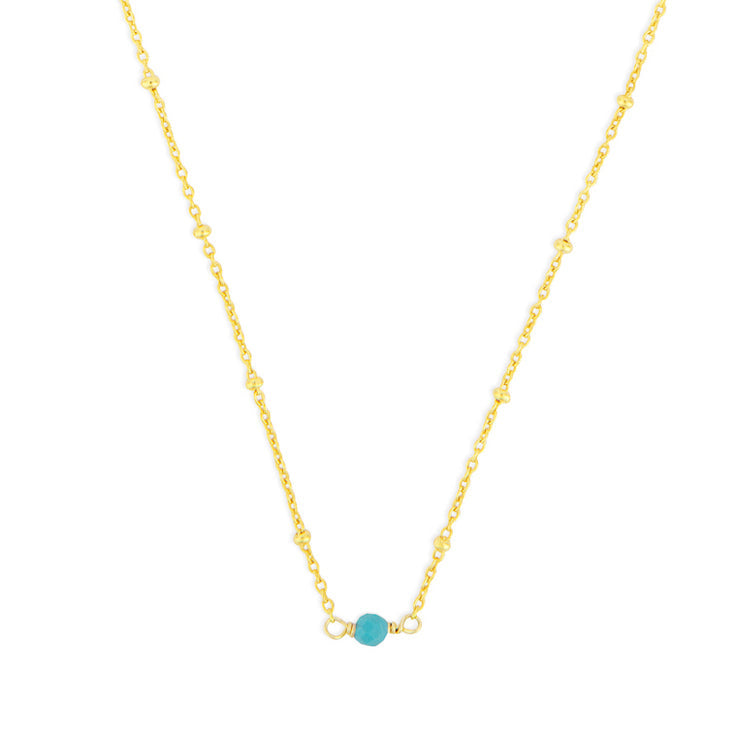December FYB Gold Birthstone Necklace featuring a dainty bezel-set stone on a delicate gold chain. Available at Be Charmed.