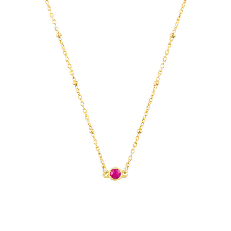 July FYB Gold Birthstone Necklace featuring a dainty bezel-set stone on a delicate gold chain. Available at Be Charmed