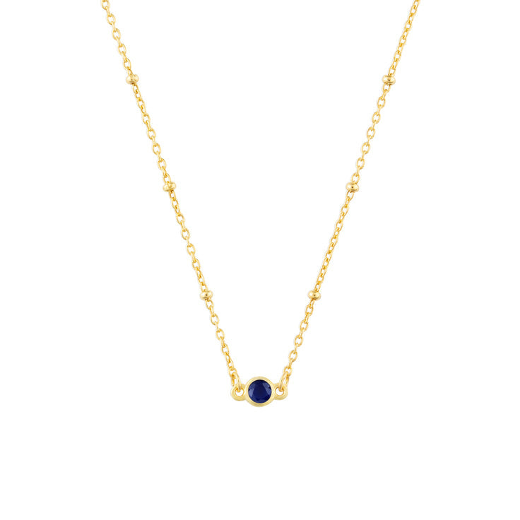 September FYB Gold Birthstone Necklace featuring a dainty bezel-set stone on a delicate gold chain. Available at Be Charmed.
