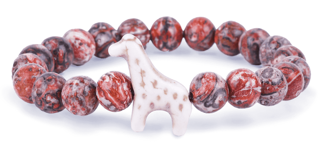 Sahara Stone Fahlo Giraffe Trek Bracelet with giraffe charm and adjustable cord. Track a real giraffe and support wildlife conservation. Available at Be Charmed