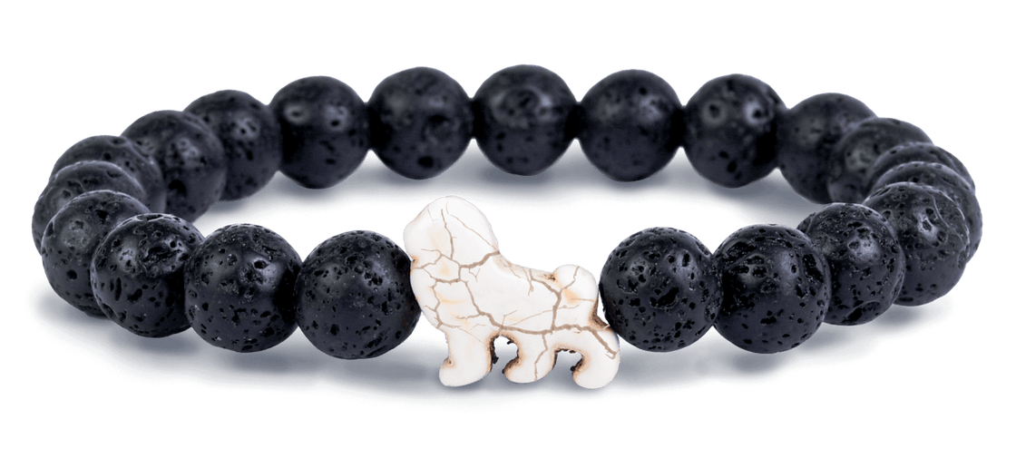 Fahlo Lave Stone beaded bracelet with a white lion figure as the central charm. Available at Be Charmed