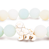 Fahlo Sky Stone beaded bracelet with a white lion figure as the central charm. Available at Be Charmed