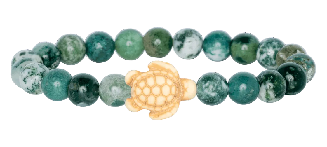 Beaded bracelet with a turtle charm on a white background. Available at Be Charmed