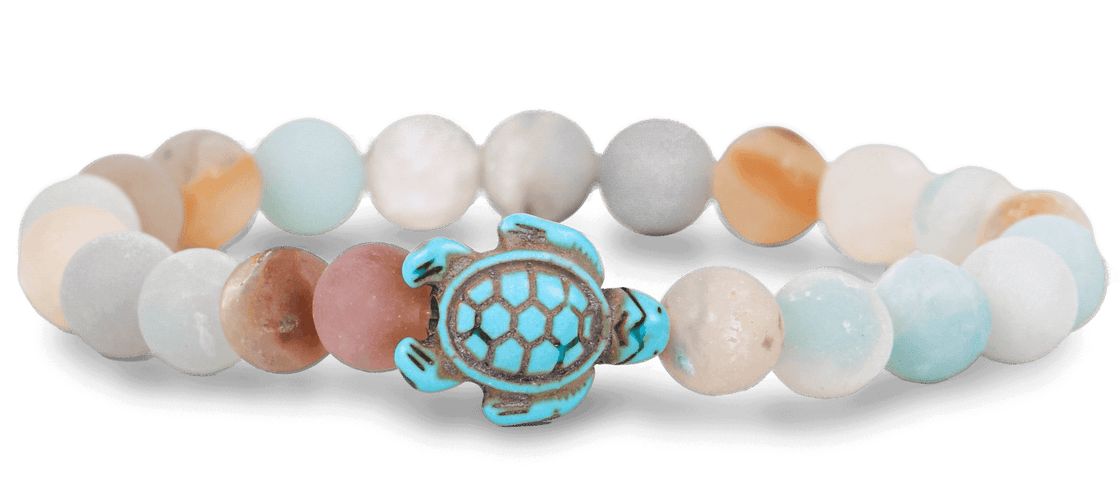 A Fahlo Sky Stone bracelet featuring a turtle charm in the center. Available at Be Charmed