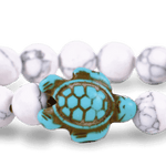 White Howlite Fahlo The Turtle Journey Bracelet with turtle charm and adjustable band. Meaningful jewelry gift. Available at Be Charmed
