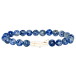 Fahlo Coastal Blue  beaded bracelet with a Whale charm on a light gray background. Available at Be Charmed