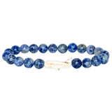 Fahlo Coastal Blue  beaded bracelet with a Whale charm on a light gray background. Available at Be Charmed