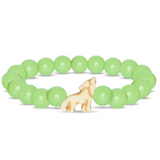 A beaded stretch Fahlo bracelet featuring light green round beads and a small cream-colored wolf charm, displayed on a clean white background. Available at Be Charmed