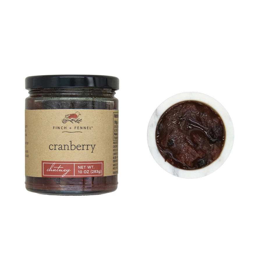 Jar of Finch + Fennel cranberry chutney with a close-up of the spreadable texture. Available at Be Charmed